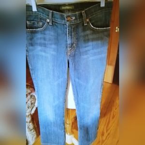 Pair of David Kahn women's bootcut med rise jeans. Size 4